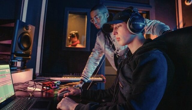 Two beatmakers working together in a production studio