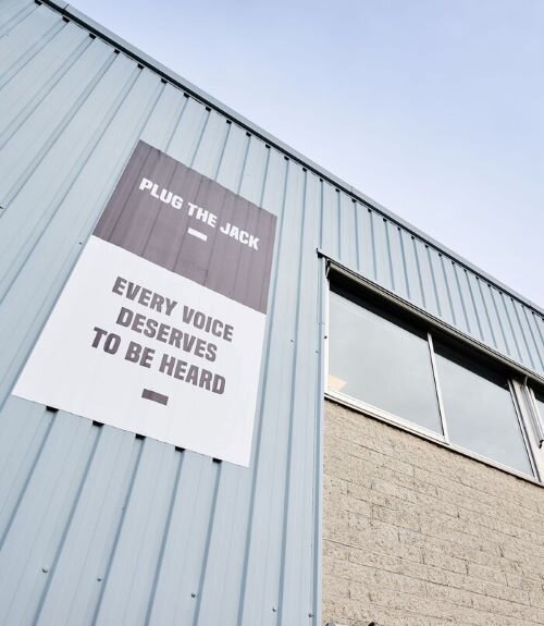 Plug The Jack building in Brussels, where the phrase 'Every voice deserves to be heard' is inscribed. | © Plug The Jack